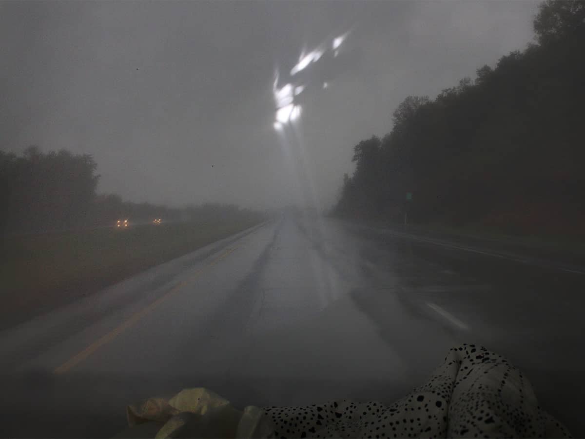 highway through car windshield.